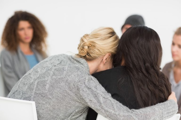 Woman hugging her friend